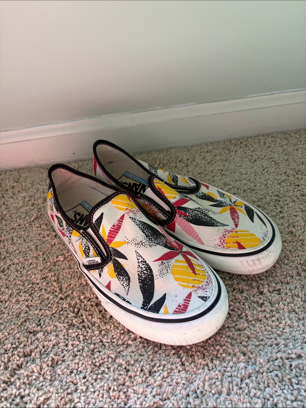 Vans Slip-On Sneakers in White with Yellow & Pink Floral Print